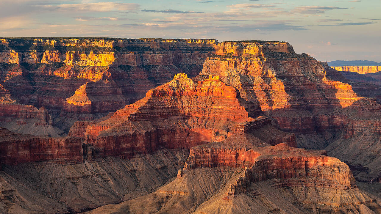 Scenic Airlines plane flying over the Grand Canyon's South Rim